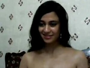Pakistani beauty seductively undresses on camera, teasing and tantalizing with every move.