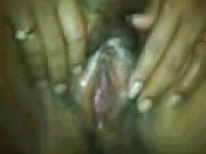 Indian wife flaunts her wet pussy in a steamy solo scene.